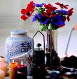 Photo of candles, flowers and a vase